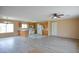 Bright living room and kitchen space with wood floors and modern appliances at 19348 W Brave Rd, Buckeye, AZ 85326
