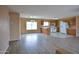 Spacious living room and kitchen featuring ample natural light at 19348 W Brave Rd, Buckeye, AZ 85326