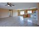 Open-concept kitchen and living area with natural light at 19348 W Brave Rd, Buckeye, AZ 85326