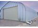 Exterior view of the property's large outbuilding, perfect for storage or workshop space at 19348 W Brave Rd, Buckeye, AZ 85326
