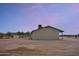 View of the rear of the home, showcasing its simple design at 19348 W Brave Rd, Buckeye, AZ 85326