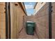 Side yard featuring low-maintenance gravel and trash receptacle, enhancing curb appeal at 2014 E Anderson Dr, Phoenix, AZ 85022