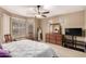 Comfortable main bedroom featuring a ceiling fan, neutral walls, and furniture at 20319 N Painted Sky Dr, Surprise, AZ 85374