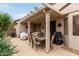 Relaxing covered patio area ideal for outdoor dining and entertainment at 20319 N Painted Sky Dr, Surprise, AZ 85374