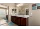 This spacious bathroom features double sinks, a large mirror, and ample counter space at 20905 N Danielle Ave, Maricopa, AZ 85138