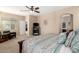 Bright bedroom showing TV, chair and decor at 20905 N Danielle Ave, Maricopa, AZ 85138