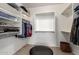 This walk-in closet features built-in shelving and ample storage space at 20905 N Danielle Ave, Maricopa, AZ 85138