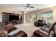 Cozy living room boasting neutral walls, plush carpet flooring, and a sliding glass door for seamless indoor-outdoor living at 20905 N Danielle Ave, Maricopa, AZ 85138