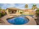 Backyard featuring a pool, a spa, palm trees, covered patio, and outdoor dining at 20905 N Danielle Ave, Maricopa, AZ 85138