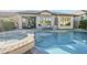 Beautiful backyard featuring a refreshing pool and spa, and comfortable patio seating at 2113 N Trowbridge St, Mesa, AZ 85207