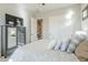 Comfortable bedroom featuring a ceiling fan, natural light and closet and ensuite bathroom access at 2113 N Trowbridge St, Mesa, AZ 85207