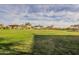 Expansive green common area with a covered picnic shelter, providing space for outdoor activities at 2113 N Trowbridge St, Mesa, AZ 85207