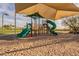 Colorful playground with slides and climbing structures, sheltered by large sunshade at 2113 N Trowbridge St, Mesa, AZ 85207