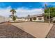 Spacious backyard featuring a basketball court, pool area, and mature landscaping at 2327 W Rockwell Ct, Chandler, AZ 85224