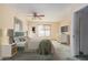 Calming bedroom with a comfy bed, ceiling fan, window, and natural light at 2327 W Rockwell Ct, Chandler, AZ 85224
