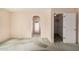 Bedroom with view of a large walk-in closet and arched hallway to outdoor access at 2327 W Rockwell Ct, Chandler, AZ 85224