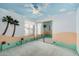 Bright bedroom with blue walls, a decorative ceiling, ceiling fan, and mirrored closet at 2327 W Rockwell Ct, Chandler, AZ 85224