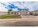 Charming single-story home with a two-car garage and well-manicured front yard at 2327 W Rockwell Ct, Chandler, AZ 85224