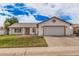 Charming single-story home featuring a two-car garage, well-maintained lawn, and desert-style landscaping at 2327 W Rockwell Ct, Chandler, AZ 85224