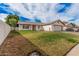 Quaint single-story home boasts an inviting front yard, a well kept lawn, and a two-car garage at 2327 W Rockwell Ct, Chandler, AZ 85224