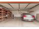 Garage with epoxy flooring, Infiniti car, and shelving for storage at 2327 W Rockwell Ct, Chandler, AZ 85224