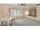 Bright living room featuring a white piano, mirrors and decorative accents at 2327 W Rockwell Ct, Chandler, AZ 85224