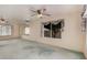 Large living room with mirrors and views of trees through the window at 2327 W Rockwell Ct, Chandler, AZ 85224