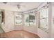 Bright sun room featuring wood floors, paint, and decorative accents at 2327 W Rockwell Ct, Chandler, AZ 85224