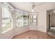 Cozy sun room with wood floors and decorative window treatments at 2327 W Rockwell Ct, Chandler, AZ 85224