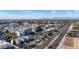 Expansive aerial view showcases the community's architecture, roads, and its surrounding landscape with mountains in the distance at 2511 W Queen Creek Rd # 479, Chandler, AZ 85248