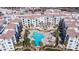 Aerial view of the stunning pool, surrounded by palm trees and seating in this community space at 2511 W Queen Creek Rd # 479, Chandler, AZ 85248