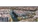 Aerial view of a charming neighborhood featuring a waterway and a pool area for residents at 2511 W Queen Creek Rd # 479, Chandler, AZ 85248