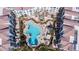 Stunning aerial view of a resort-style pool surrounded by luxurious condos and well-manicured landscaping at 2511 W Queen Creek Rd # 479, Chandler, AZ 85248