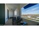 An appealing balcony with seating overlooking a landscape with trees, shrubbery, and distant mountains at 2511 W Queen Creek Rd # 479, Chandler, AZ 85248