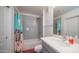 Bright bathroom featuring a shower-tub combination with gray subway tile and single vanity sink at 2511 W Queen Creek Rd # 479, Chandler, AZ 85248
