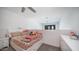 Bedroom featuring ceiling fan, a bright open feel, with a plush bed and colorful stuffed animals at 2511 W Queen Creek Rd # 479, Chandler, AZ 85248