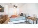 A spacious bedroom features a large bed, ceiling fan, and access to an en-suite bathroom at 2511 W Queen Creek Rd # 479, Chandler, AZ 85248