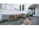 Stunning building entrance featuring a tranquil waterfall and contemporary design elements at 2511 W Queen Creek Rd # 479, Chandler, AZ 85248