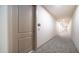 Well-lit hallway features modern carpeting and apartment door number 479 at 2511 W Queen Creek Rd # 479, Chandler, AZ 85248