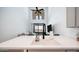 A bright kitchen view showcasing the sink and faucet with a view of the open living area at 2511 W Queen Creek Rd # 479, Chandler, AZ 85248