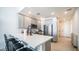 Modern kitchen with stainless steel appliances, a breakfast bar, and gray cabinets at 2511 W Queen Creek Rd # 479, Chandler, AZ 85248