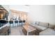 Open concept living room that flows into a kitchen with a breakfast bar, sofa, and stylish decor at 2511 W Queen Creek Rd # 479, Chandler, AZ 85248
