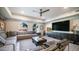 Stylish living room featuring a comfortable seating area, a large flat-screen TV, and ample lighting at 2511 W Queen Creek Rd # 479, Chandler, AZ 85248