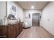 Modern lobby with wood floors, an elevator, a cozy chair, and artwork at 2511 W Queen Creek Rd # 479, Chandler, AZ 85248