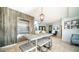 Enjoy the modern lobby area featuring a high-top table, elegant lighting, and elevator access at 2511 W Queen Creek Rd # 479, Chandler, AZ 85248