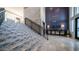 The Cays Lobby featuring a staircase with unique tile, iron railing, and contemporary lighting fixtures at 2511 W Queen Creek Rd # 479, Chandler, AZ 85248