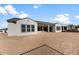 Expansive backyard featuring desert landscaping and a covered patio perfect for outdoor living and entertaining at 26535 W Mcrae Dr, Buckeye, AZ 85396