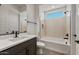 Chic bathroom featuring modern vanity, tub, and elegant tile work, combining comfort and style at 26535 W Mcrae Dr, Buckeye, AZ 85396