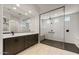 Modern bathroom featuring a frameless glass shower, double vanities, and neutral tones for a calming ambiance at 26535 W Mcrae Dr, Buckeye, AZ 85396