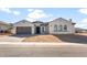 Stunning single-story home featuring a three-car garage, elegant arches, and neutral color palette at 26535 W Mcrae Dr, Buckeye, AZ 85396